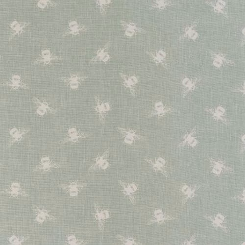 Duck egg cotton fabric with small pale bee motifs and a softly textured weave