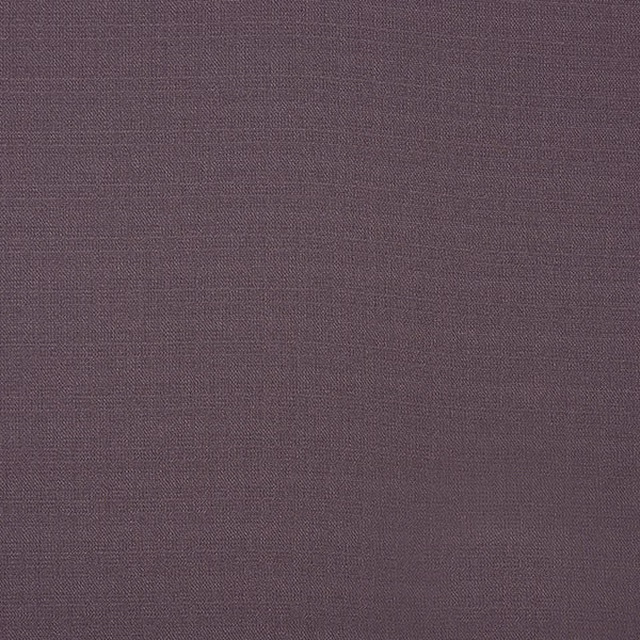 Close-up of muted heather plum woven fabric with fine textured surface