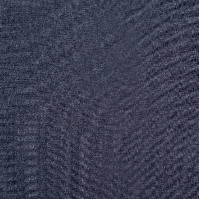 Close-up of a deep indigo plain woven fabric with fine texture