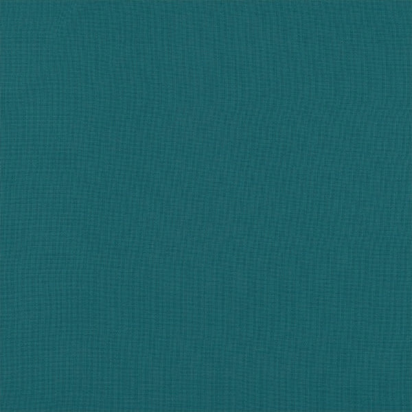 Close-up of plain jade teal woven fabric with fine textured surface