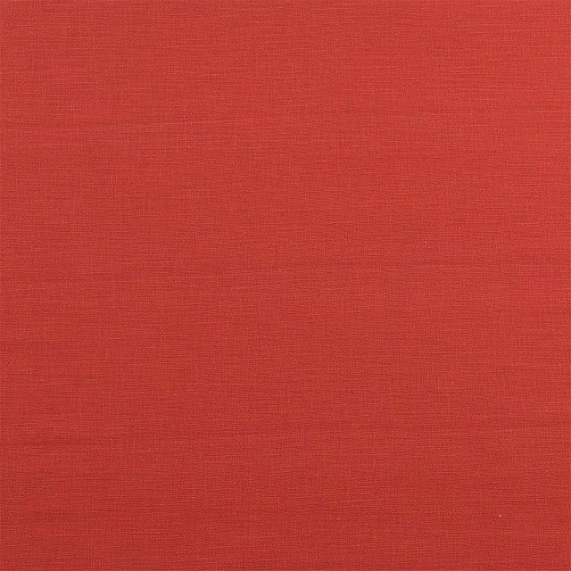 Solid burnt sienna red cotton swatch with fine horizontal woven texture