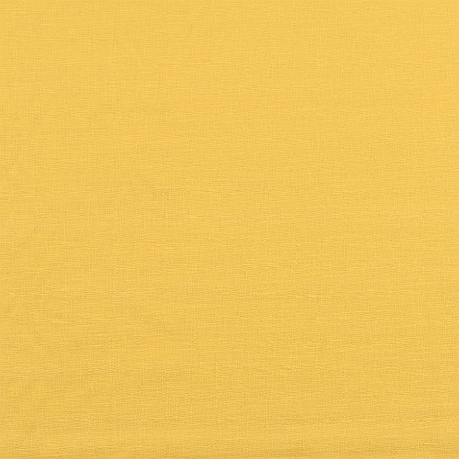 Plain soft butter-gold cotton fabric with a smooth matte weave