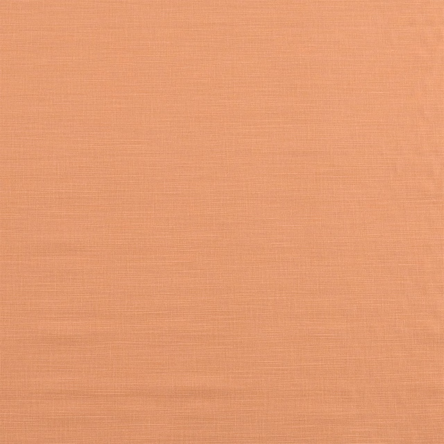 Plain peach-rust cotton swatch with fine horizontal texture