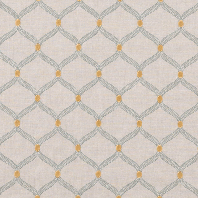 Pale seafoam geometric trellis fabric with small ochre dots on a light ground