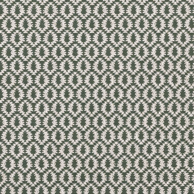 Close-up of small jade green geometric pattern on a pale woven fabric