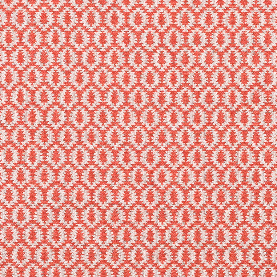 Textured paprika red woven fabric with small cream oval repeat
