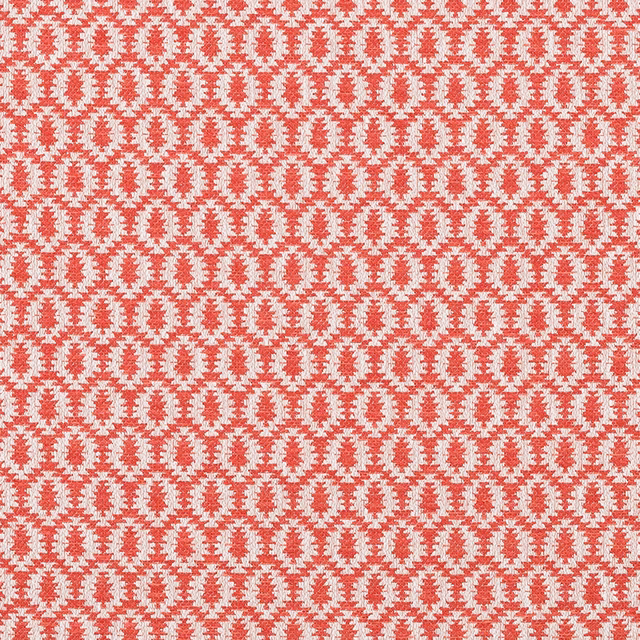 Textured paprika red woven fabric with small cream oval repeat