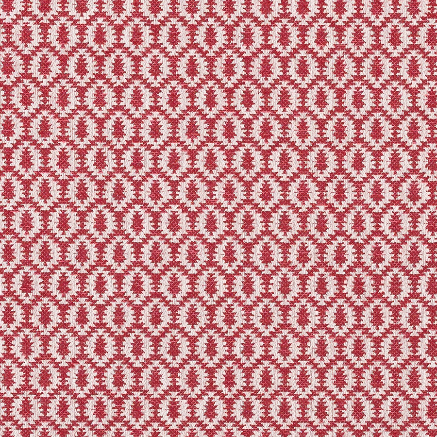 Close-up of red and pale geometric woven fabric with small repeating motif