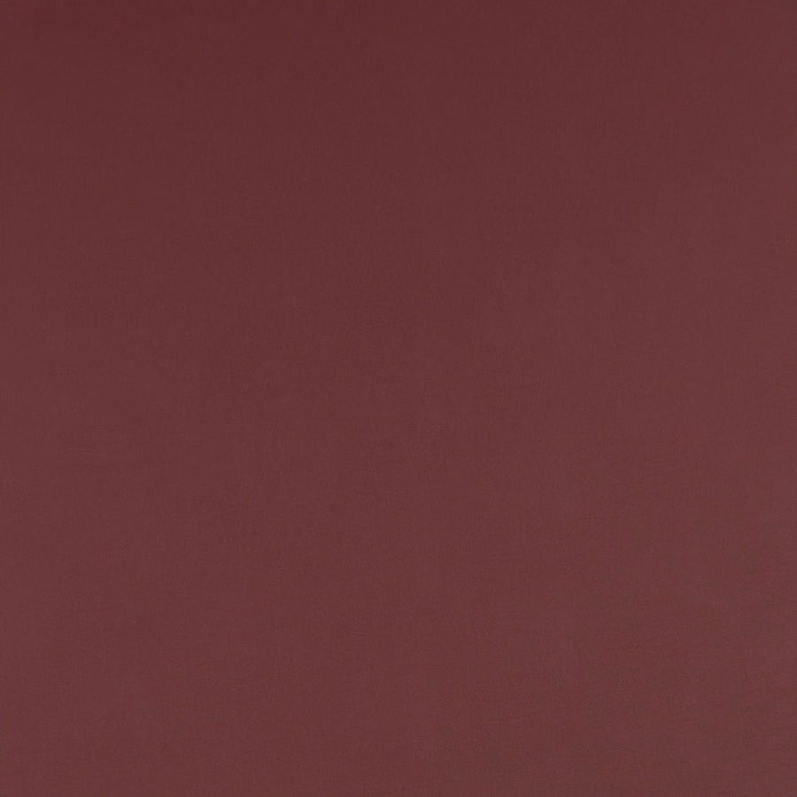 Deep mulberry red plain woven fabric with a smooth matte finish