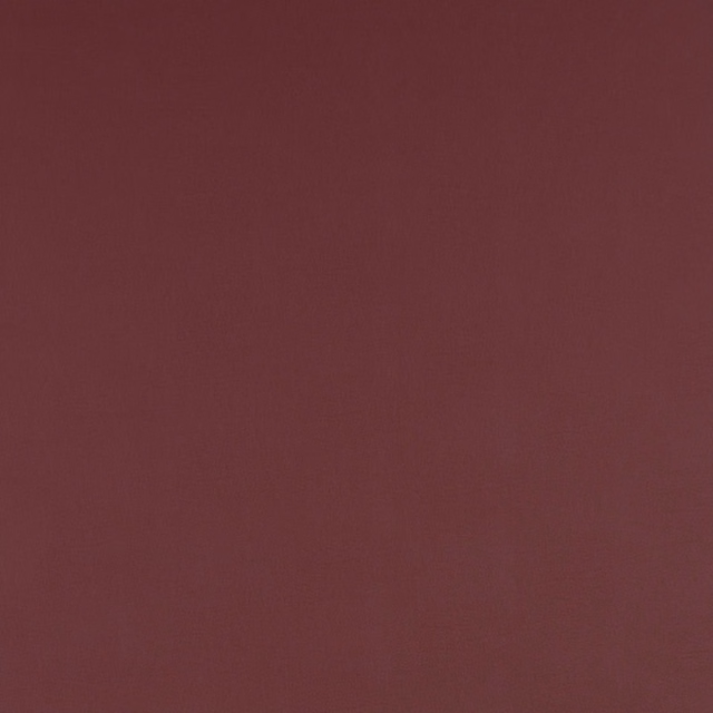 Deep mulberry red plain woven fabric with a smooth matte finish