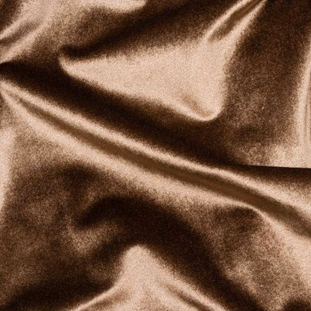 Shiny warm latte beige fabric with soft folds and rich brown shadows