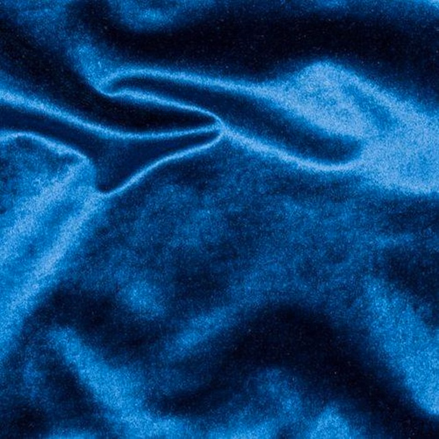 Shiny deep petrol blue fabric with soft folded sheen and smooth texture