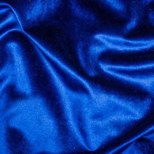 Shiny royal blue velvet-look fabric with deep folds and highlights