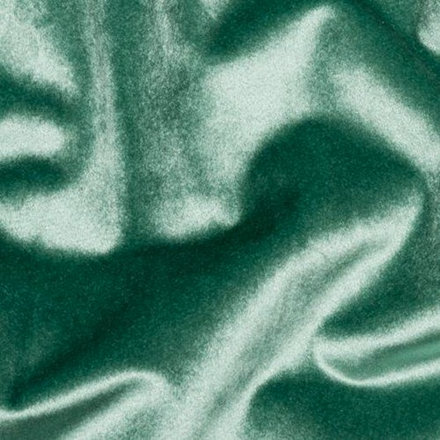 Glossy deep seafoam green fabric with silky light-catching folds