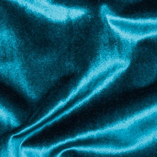 Glossy teal velvet-look fabric swatch with deep folds and bright highlights