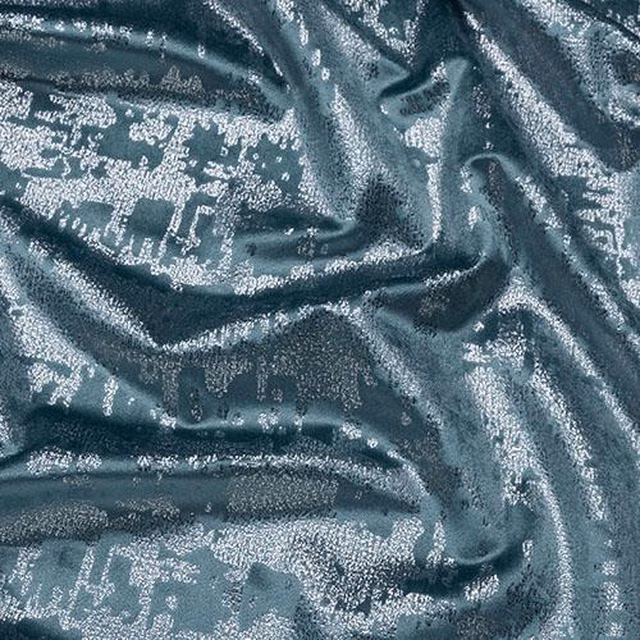 Shimmering duck egg blue patterned fabric with metallic silver highlights and a soft crinkled texture