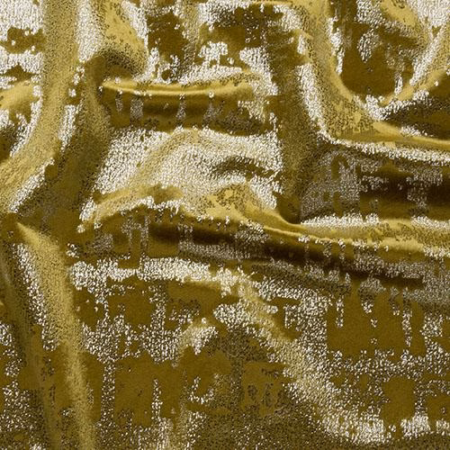 Close-up of a glossy ochre-gold abstract fabric with crumpled texture and light-catching highlights