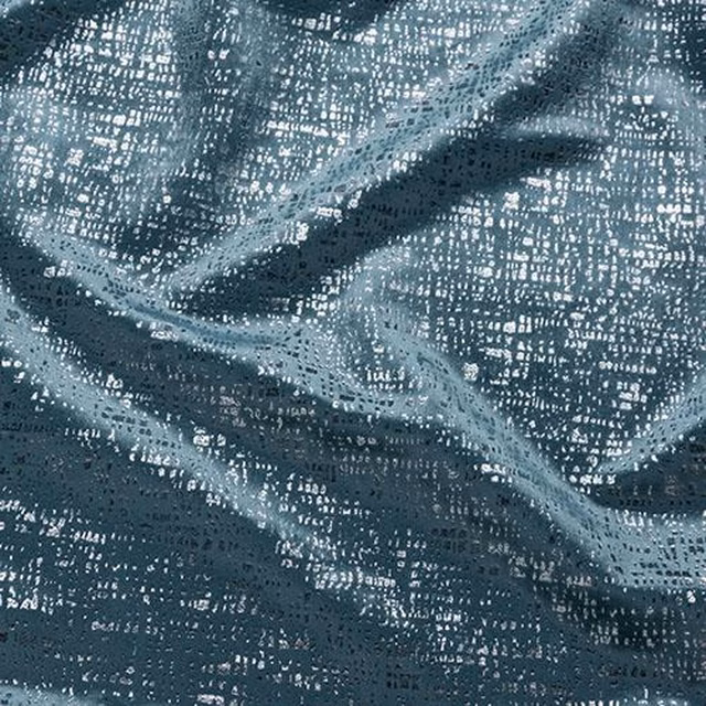 Close-up of textured duck egg blue fabric with abstract woven sheen and speckled pattern