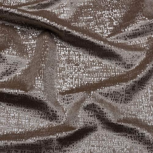 Close-up of warm taupe shimmer fabric with fine dark speckling and soft folds