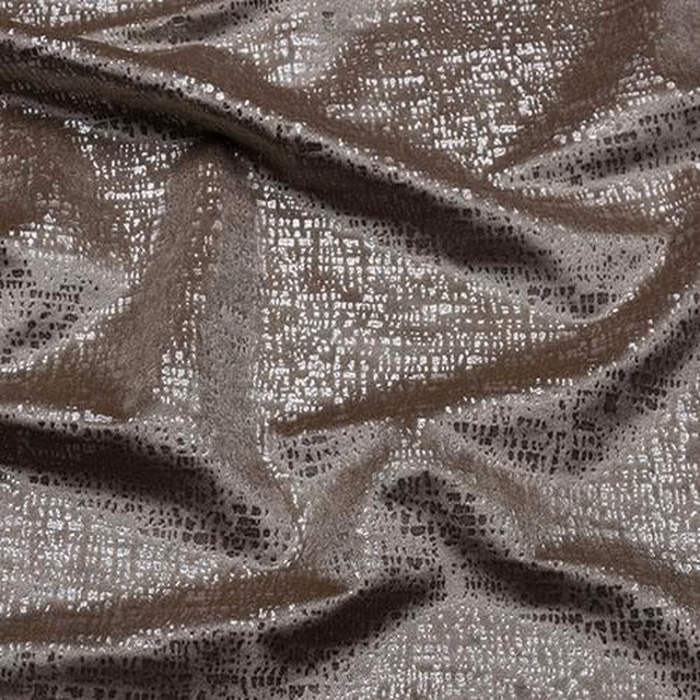 Close-up of warm taupe shimmer fabric with fine dark speckling and soft folds