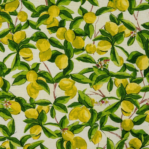 Lemon and green leafy botanical print on a pale cotton ground