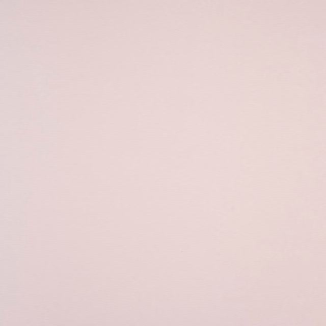 Pale blush pink plain-woven cotton fabric with a soft matte finish