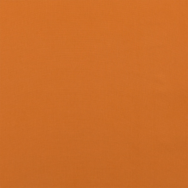 Burnt orange plain woven cotton fabric swatch with fine texture