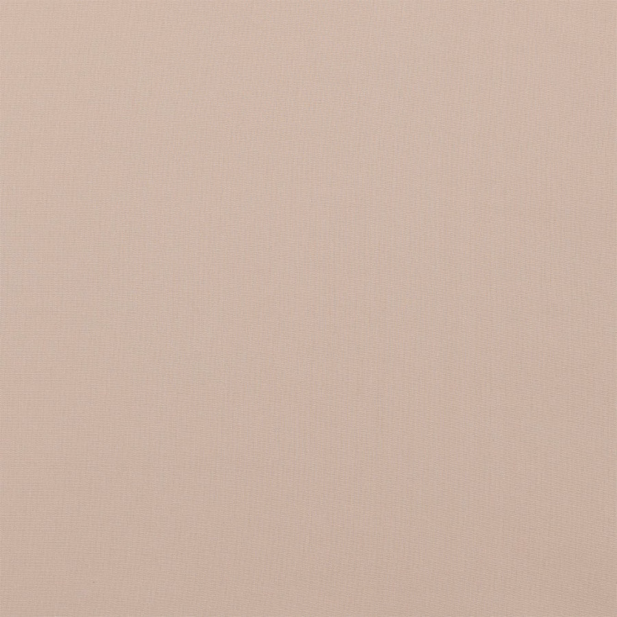 Close-up of soft caramel beige plain cotton fabric with fine weave texture