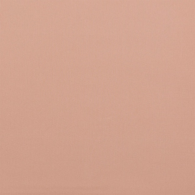 Soft dusky blush pink woven cotton fabric with a fine textured surface