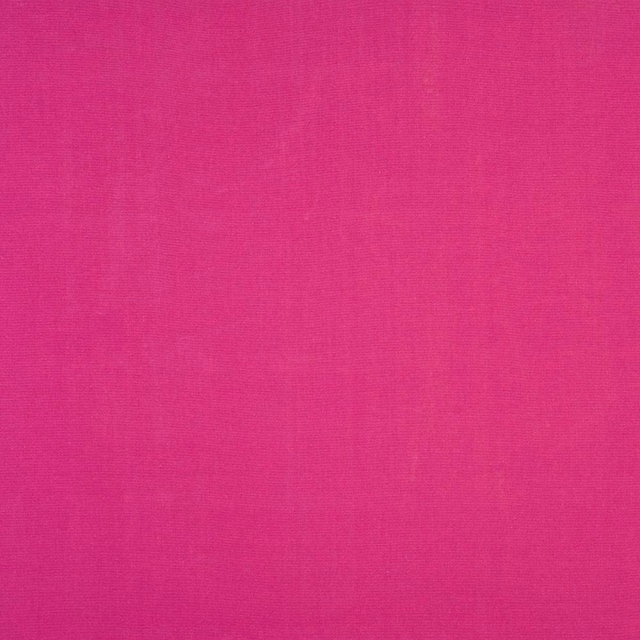 Vivid fuchsia pink plain-woven cotton fabric swatch with a smooth matte texture