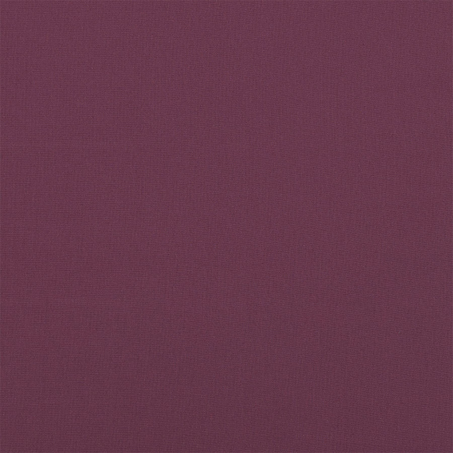 Close-up of deep grape purple woven cotton fabric with fine texture