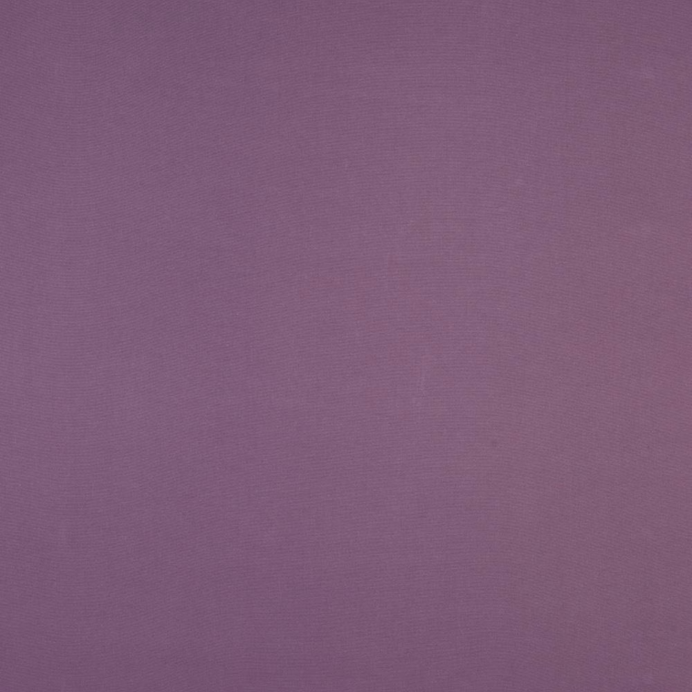 Close-up of muted heather purple plain-woven cotton fabric with a fine texture.