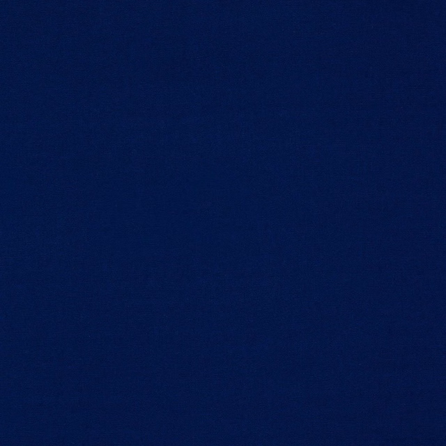 Close-up of a deep indigo blue plain cotton weave fabric swatch
