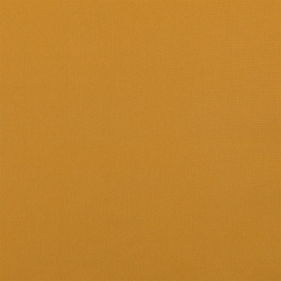 Warm old gold plain weave cotton fabric swatch with fine texture