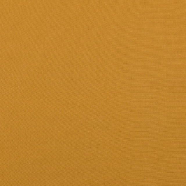 Warm old gold plain weave cotton fabric swatch with fine texture