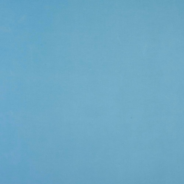 Soft sky blue plain cotton fabric with fine diagonal weave texture