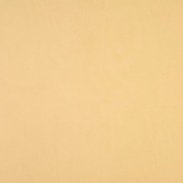 Soft willow-yellow plain cotton fabric with a subtle woven texture