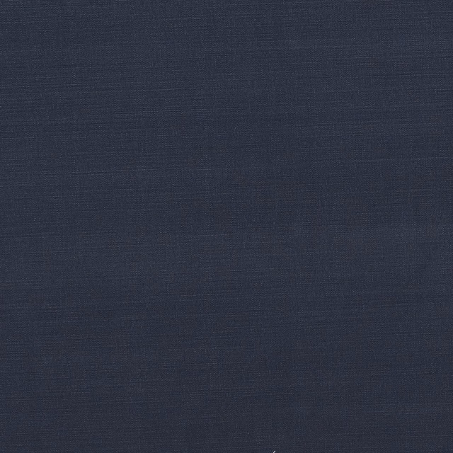 Close-up of deep navy cotton fabric with a fine, even weave
