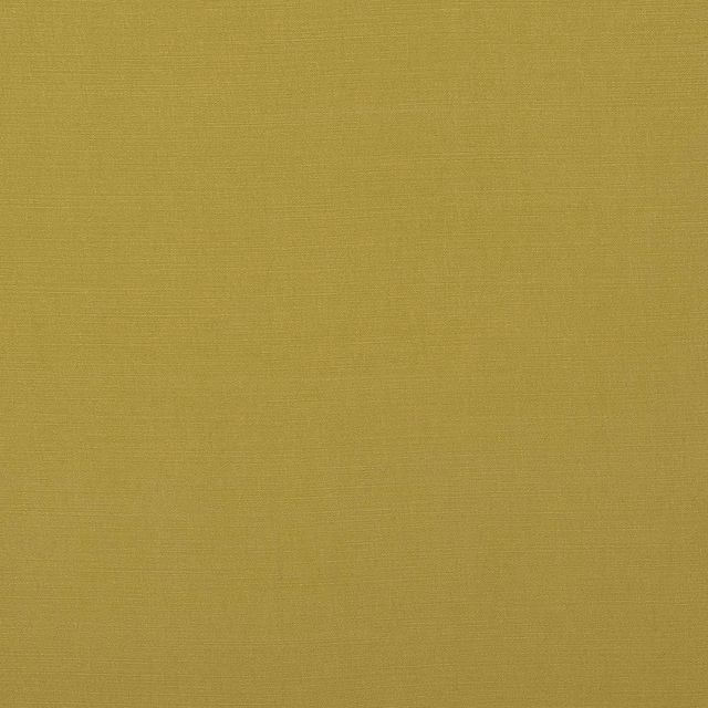 Close-up of muted lime-yellow woven cotton fabric with a fine, even texture