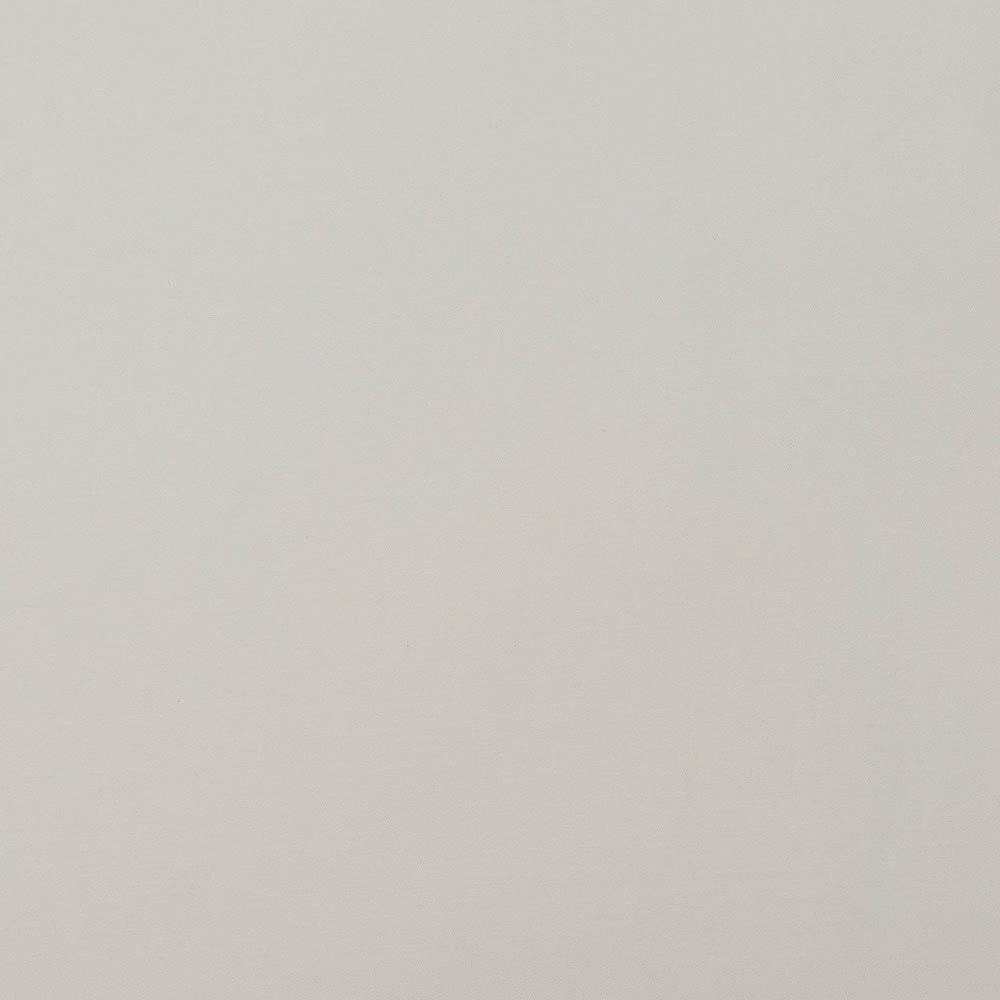 Soft warm white plain cotton fabric swatch with a smooth, fine weave