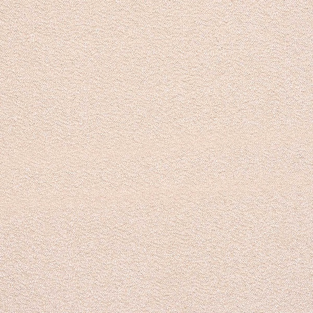 Close-up of pale dusky rose bouclé fabric with a fine looped texture