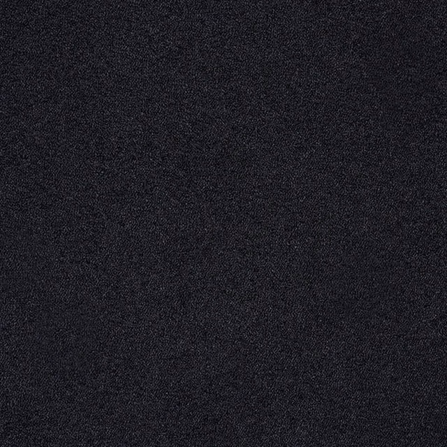Close-up of soft charcoal-black boucle upholstery fabric with fine speckled texture