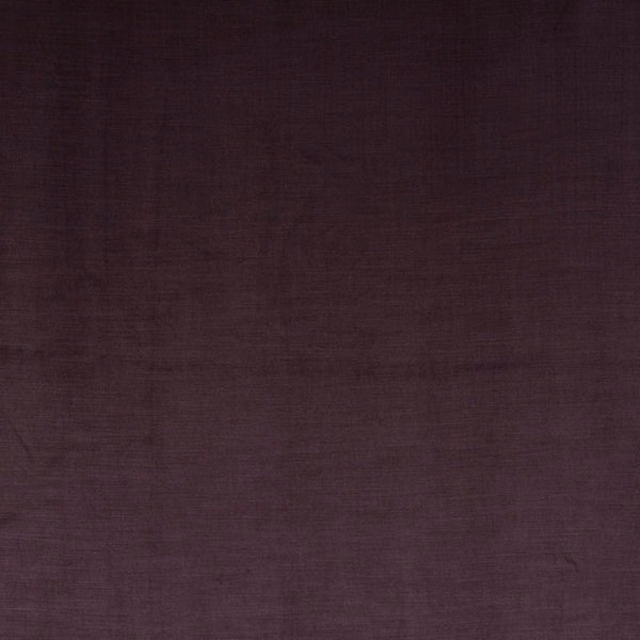 Close-up swatch of deep plum-purple woven fabric with a subtle matte texture