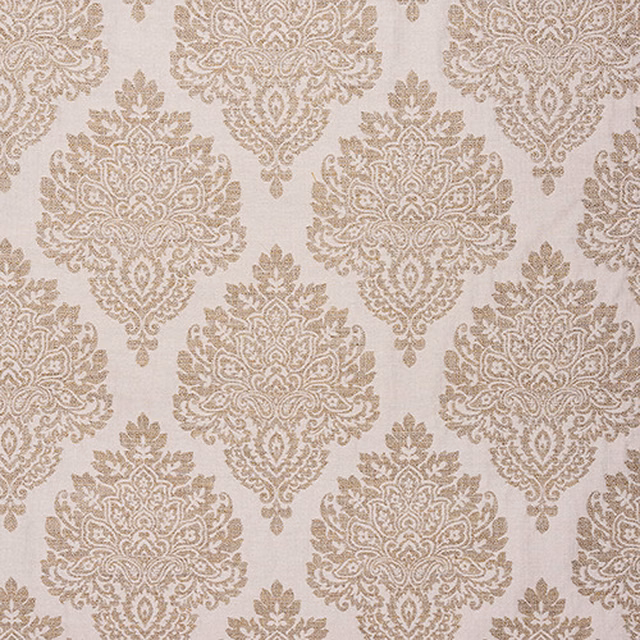 Ochre damask motif on a pale ivory woven fabric swatch