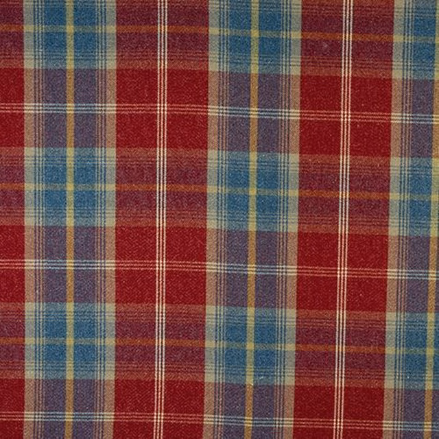 Close-up of ruby red tartan check fabric with teal, gold and blue stripes