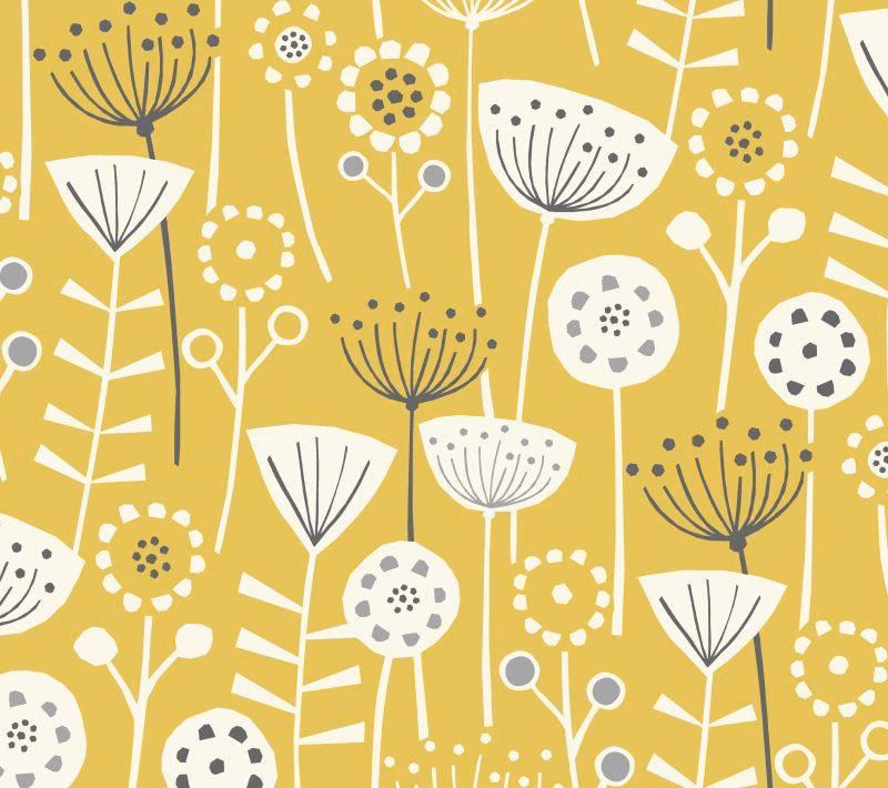Ochre cotton fabric with scattered white and charcoal stylised floral motifs