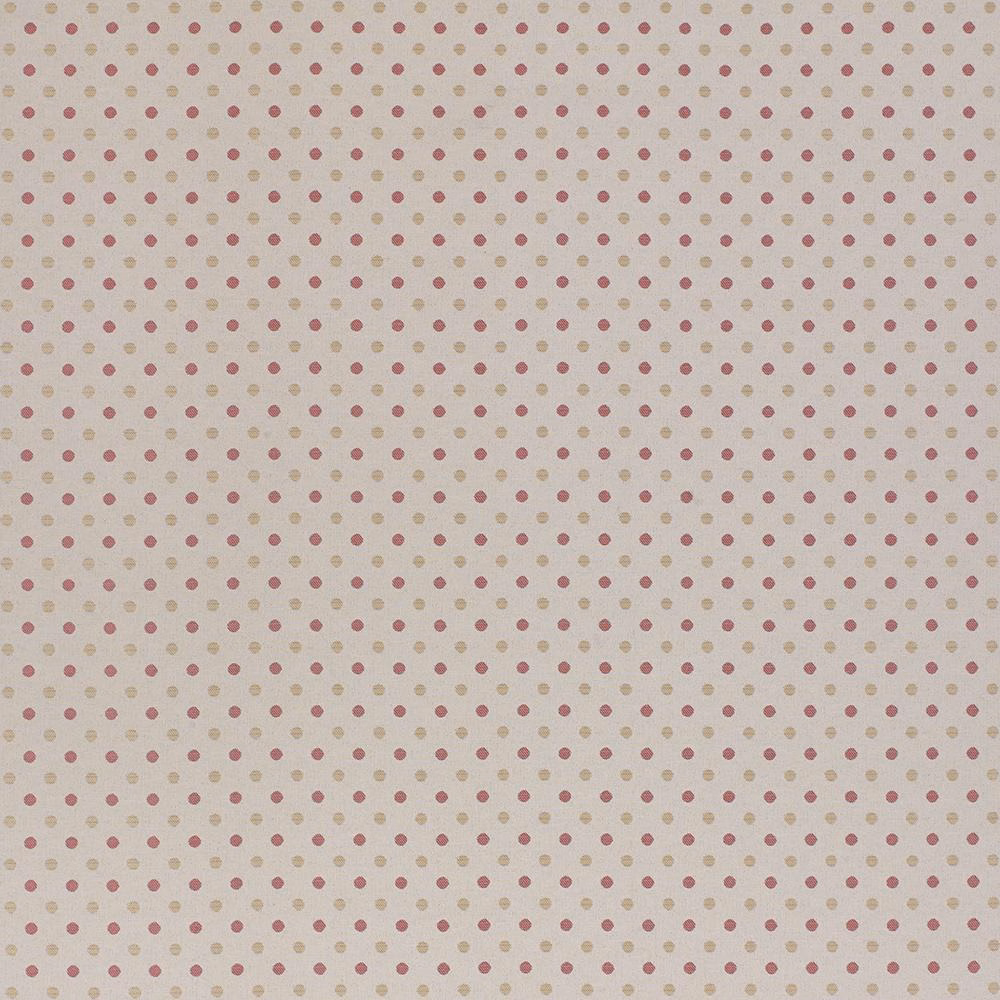 Soft dusty pink polka-dot fabric on a warm ivory ground
