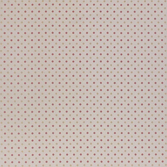 Soft dusty pink polka-dot fabric on a warm ivory ground