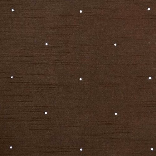 Close-up of rich mocha brown woven fabric with small scattered white dot motif