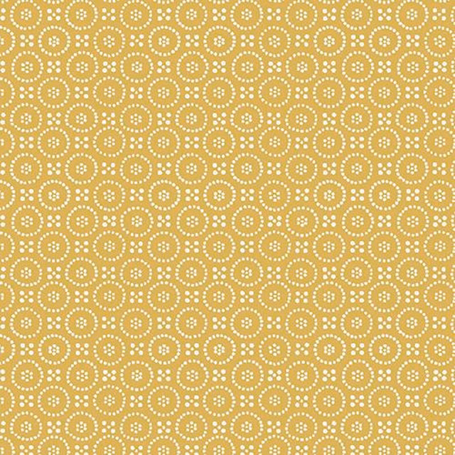 Ochre cotton fabric with small cream dotted circle motif